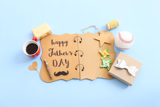 Father's day concept. present box and funny moustache over blue background. top view, flat lay