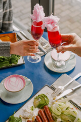 celebratory dinner with glasses of pink champagne