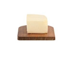 A piece of butter on a wooden board over a white background.