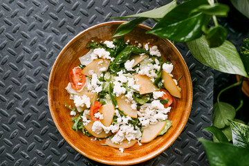summer salad with pear cheese and vegetables