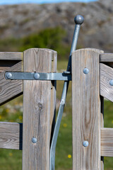 locking mechanism on a rural wooden fence gate