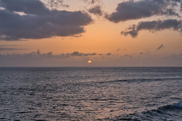 Beautiful sunset on the Atlantic Ocean off the coast of Madeira island, Portugal, seen from Calheta