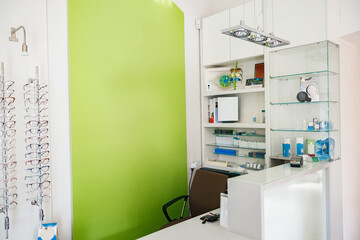 Ophthalmologist's workplace with spectacle frame and other work equipment