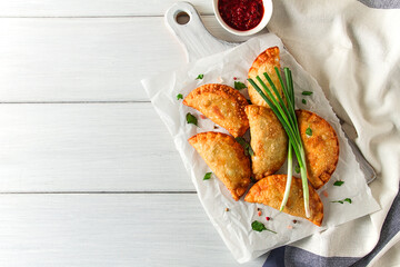 Fried chebureks, close-up, on a light background, no people,