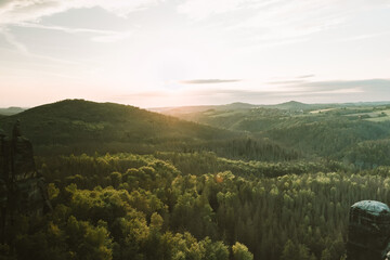 Fototapeta premium Sunset at mountain Schrammsteine (Elbsandsteingebirges). View from Häntzschelstiege in Saxon Switzerland National Park, Germany