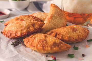 Fried chebureks, close-up, on a light background, no people,