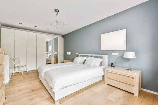 Light bedroom interior with wooden furniture and floor in cottage - Powered by Adobe