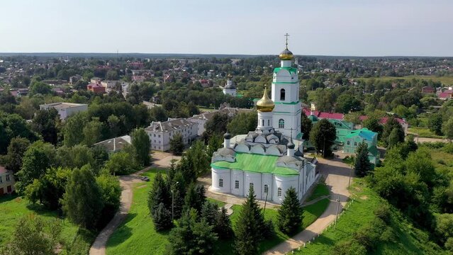 Tilt down aerial shot of Troitsky cathedral (1674-1676) and Vyazma town on sunny summer day. Smolensk Oblast, Russia.