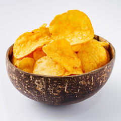 golden crispy potato chips on a white background