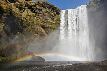 A double rainbow above the river just downstream from the famous Skogafoss waterfall in Iceland