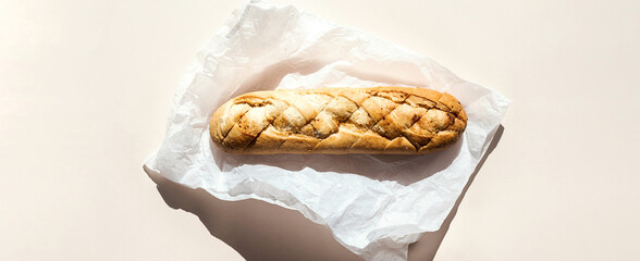 Wheat bread loaf on parchment paper.