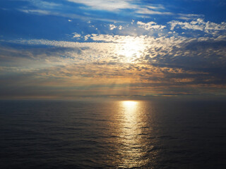 Beautiful seascape in the summer. Sunset over kattegat sea between Denmark and Sweden, Europe. Reflection of the sun on the ocean in the evening.