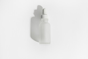 Light cosmetic bottle. Liquid filled. On a white background, 3d, aroma, background, beauty, blank, bottle, cap, care, clean, container, cosmetic, design, drop, dropper, empty, essential, eye, flask, g