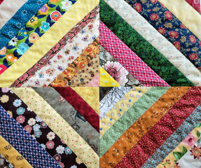 Close up of a colorful quilted print pattern 