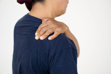 Closeup elderly woman's hand massage her shoulder. Concept : health problems. Senior healthcare....