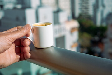 hand with morning coffee