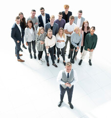 top view. young leader standing at the front of the business team