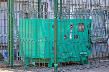 Emergency electric generator in cage