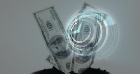 Image of clock over banknotes