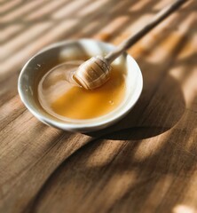 honey dripping from a wooden spoon