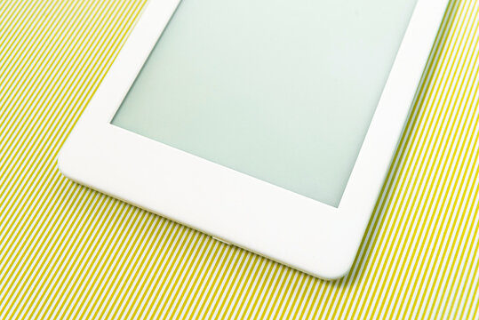 Ebook reader over green striped background