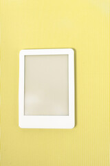 Ebook reader over green striped background