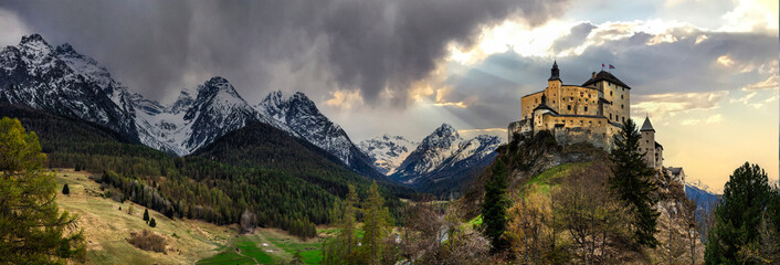 Impressive  mountain scenery with amazing medieval castle Tarasp surrounded by  Swiss Alps, Canton...