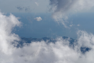 Fog revealing the mountain range in Maritime Alps, Italy
