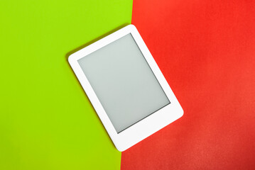 Ebook reader over yellow and red background