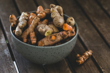 Turmeric roots in bowl