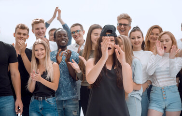 close up. a group of young people applauding their victory