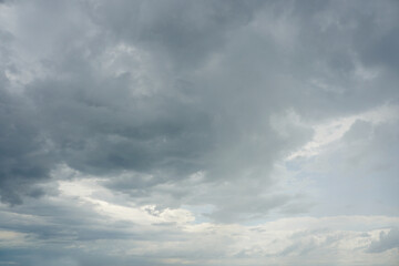 Dark and grey featureless layers of nimbostratus clouds