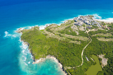 Stone cliff washes with Atlantic ocean. Macao beach. Dominican Republic. Aerial view