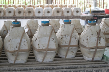 The molds for making vases are laid out on rack waiting for the soil to form. Process of making a...