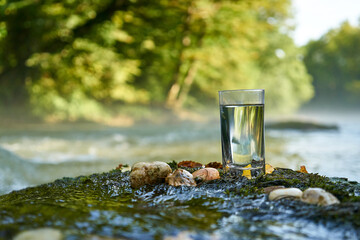 Flask with clear river water.