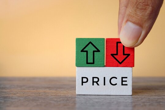 Wooden cubes with text PRICE, upward and downward arrow. Price change, increase and decrease concept