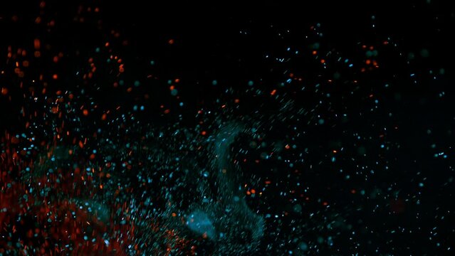 Super slow motion of colored fire sparks isolated on black background. Filmed on high speed cinema camera, 1000 fps.