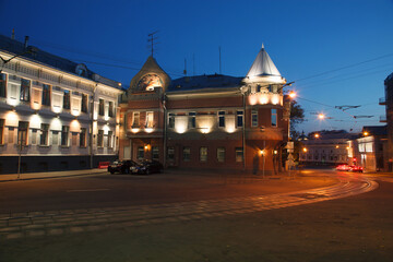 Fototapeta premium Moscow, Russia - July, 27 2014: Historical buildings in Moscow center at night. Mansion on Yauza boulevard. Tram rails and light traces on foreground.