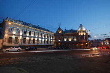 Naklejka premium Moscow, Russia - July, 27 2014: Historical buildings in Moscow center at night. Mansion on Yauza boulevard. Tram rails and light traces on foreground.