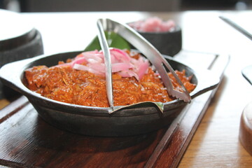 Casserole of the traditional Yucatecan dish called Cochinita Pibil