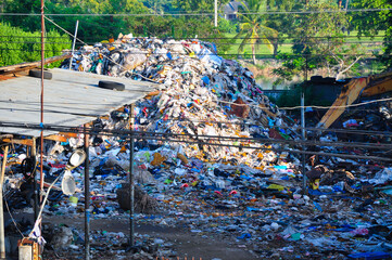 Mountain garbage waste in underdeveloped countries,stench, pollution,dangerous, sediment, sewage, dust, smoke, lead, heavy metals,Big garbage mountain