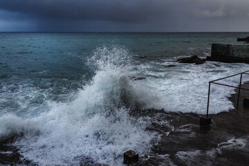 Storm at sea. Sea view with waves during rain and cloudy in Alupka. Crimea