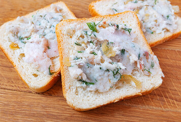Bread spread with lard with spices, fresh dill and fried onions. Home food. 