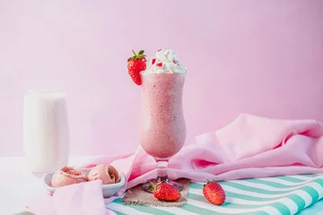 Zelfklevend Fotobehang decorated strawberry ice cream milkshake with pink color background.different angles view © serkan
