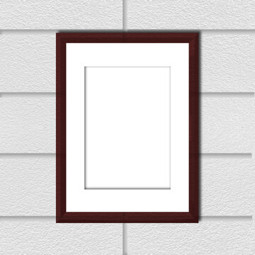 Mock up: brown frame with passe-partout on grey brick wall.
