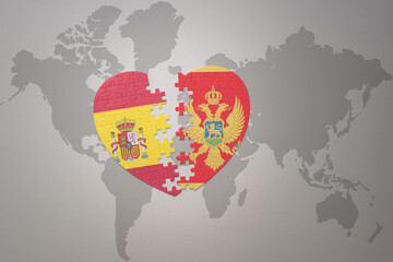 puzzle heart with the national flag of montenegro and spain on a world map background. Concept.