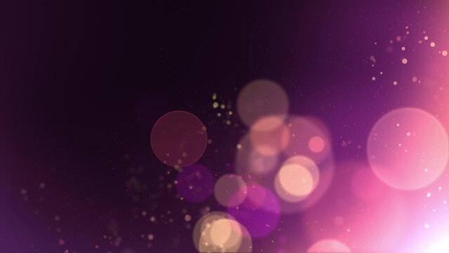 Beautiful abstract bokeh particles in pink and purple wave in the wind slowly over a dark background loop