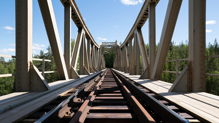 train bridge in the forest - Powered by Adobe
