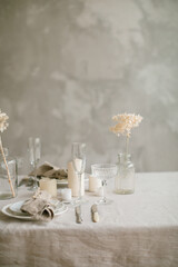 Aesthetics table setting in beige colors. Natural materials, home decorations. Copy space.
