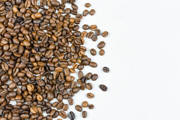 Roasted coffee beans close-up on a gray (white) background. Place for the text (copy paste). Template for the cafe menu.